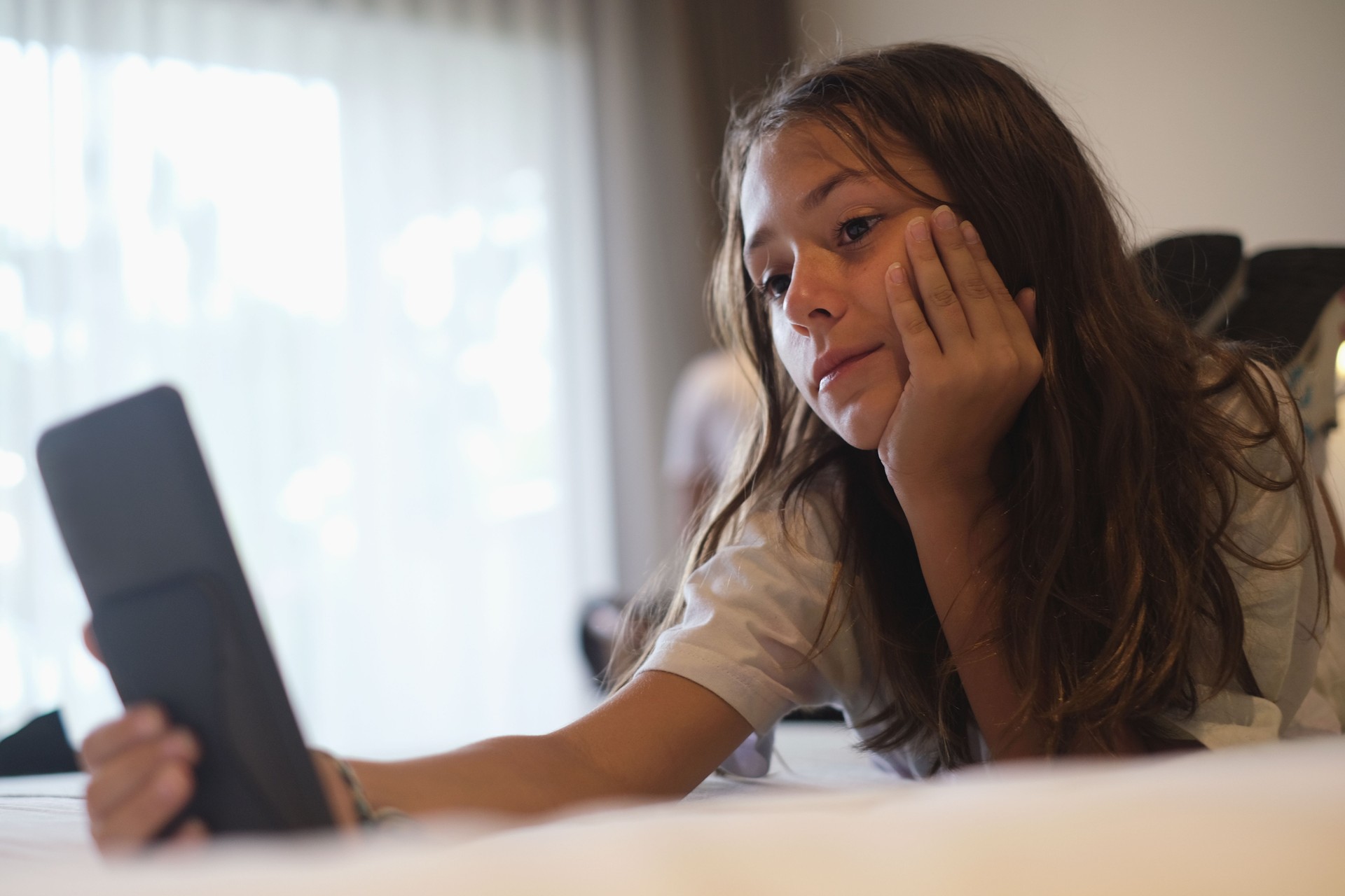 Multiracial Teenage Girls Watching Video on Digital Tablet